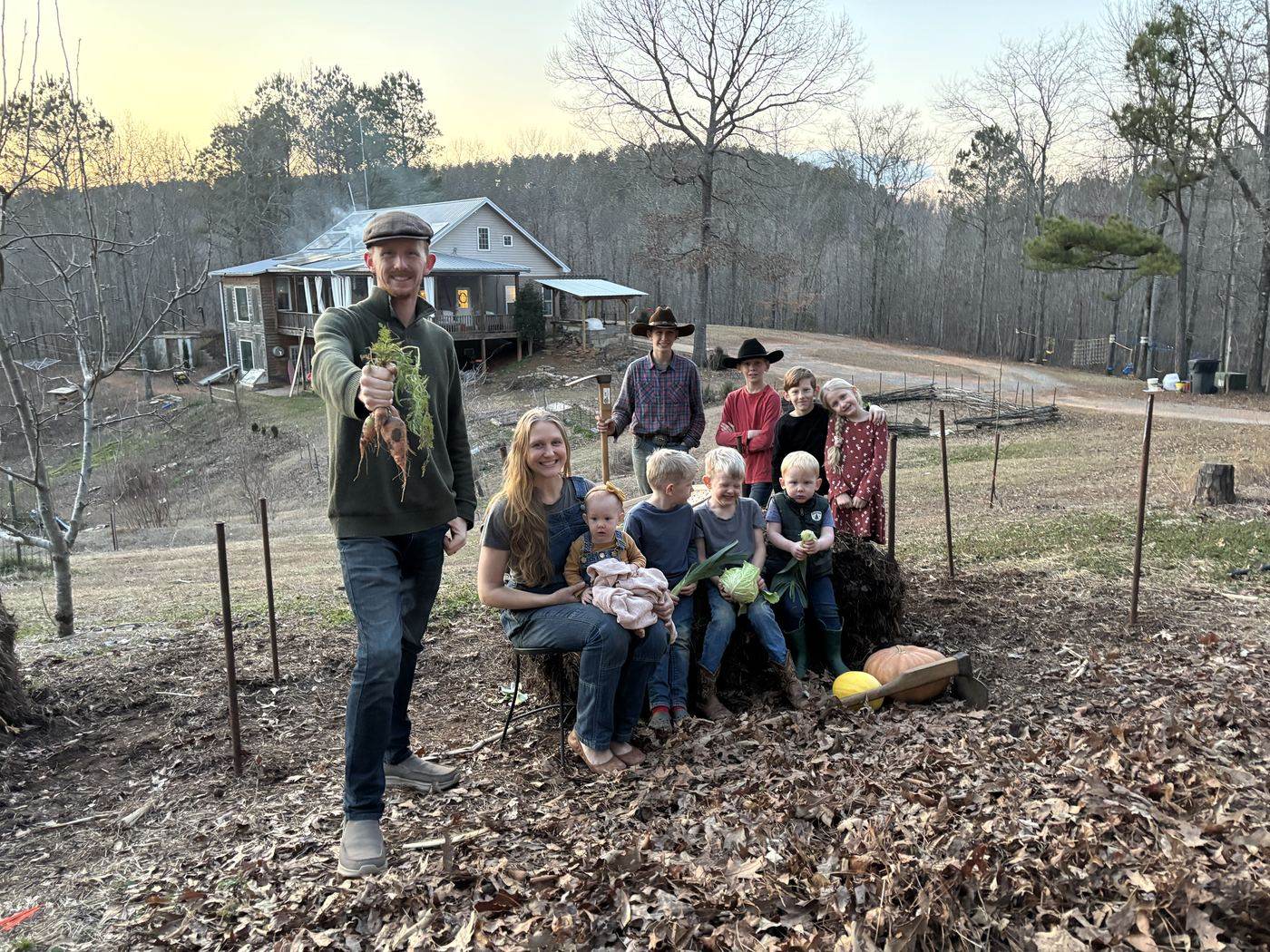 The Sanders family in their garden on their off-grid Alabama homestead